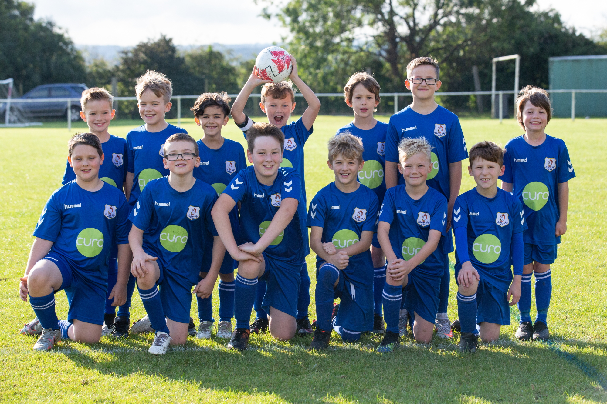 Youth football teams sport new strip thanks to Curo sponsorship